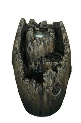 Невеликий декоративний фонтан за формою старого пня